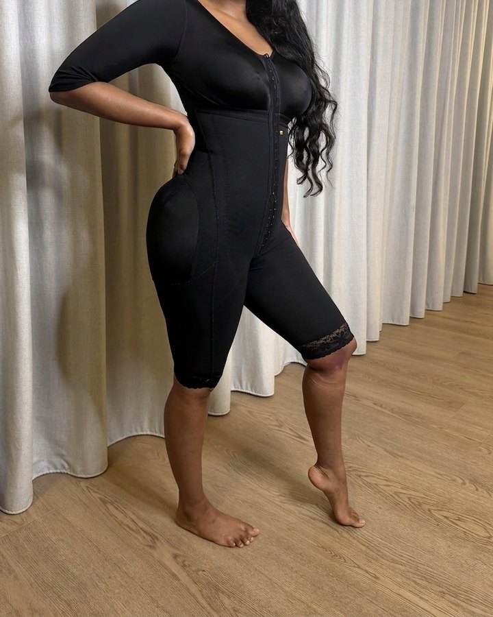 Client wearing a fitted stage-two compression faja, identifying features removed